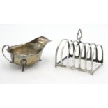 A silver sauce boat, together with a silver six section toast rack, 6.7oz.