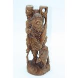 A Chinese carved wood figural lamp base, circa 1900, height 43cm.
