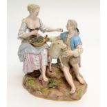 A Meissen porcelain group of a shepherd and shepherdess, 19th century, each seated on a stump,