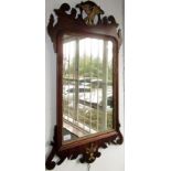 A walnut veneered parcel gilt mirror in 18th century style, 89 x 52cm.