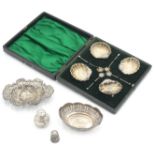 A set of four silver shell salts with matching shell spoons, cased,