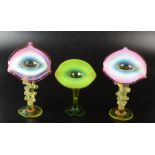 A pair of vaseline glass Jack in the Pulpit vases each with cranberry tinted rim together with one