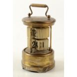 An Ever Ready brass cylindrical desk clock, height 12.
