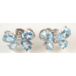 A pair of post-war, white gold, aquamarine and diamond butterfly earrings.