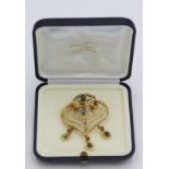 A Middle Eastern 18 ct gold heart form brooch/pendant set with stone cabouchons, 21.7g.