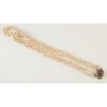 A double strand pearl necklace, the largest being 8.