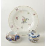 A Meissen outside decorated small cup and saucer in 18th century style cancelled mark,