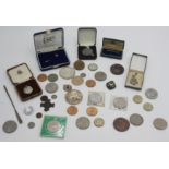 A silver Royal Lifesaving Society award of merit dated 1928, boxed, together with various coins,