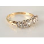 An 18ct yellow gold five stone diamond ring.