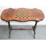 A Victorian walnut centre table, with an inlaid chessboard top, height 70cm, width 91cm, depth 45cm.