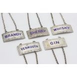 A set of five modern silver and enamel decanter labels for Gin, Brandy, Sherry, Whisky and Vermouth,