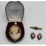 A cameo brooch and matching earrings, together with gold bar brooch set garnets.