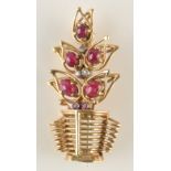 A stylish 1950s Italianate yellow gold brooch in the form of a cabochon ruby and diamond set plant