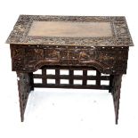 A Chinese carved camphor wood chest, height 57cm, width 101cm, depth 51cm.