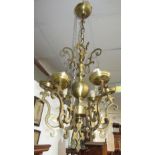 A Dutch style brass hanging electrolier, with central ball finial and six arms, height 63cm.