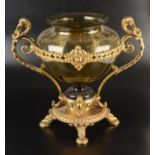 A late 19th century continental olive green glass baluster vase in ornate ormolu stand with lion