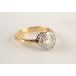 An 18ct gold ring set a diamond cluster, the central stone of approximately 0.5ct.