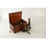 A brass and black lacquered microscope, by 'Swift & Son, 81 Tottenham Ct Rd, London WC',