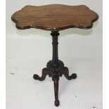 A Victorian mahogany tripod table, the shaped top on a turned and fluted stem,