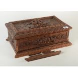 A carved wood box, width 44.5cm.