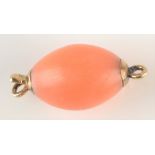 A gold mounted coral bead clasp.