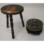 A penwork ebonised stool, the top decorated with pixies, on three turned legs, height 36 cm,