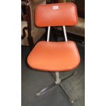 A Steelux London orange vinyl and white painted metal swivel chair, label to base, height 70cm,