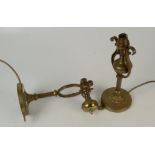 A pair of brass gimbal lamps, of classical form, with heavy weighted bases, height 27cm.