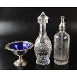 A cut glass decanter by Waterford, a silver plated bowl with blue glass liner,