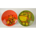 Two Poole shape 4 bowls, one with orange ground, the other green.