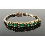 A good emerald and diamond bracelet set in 18ct yellow gold,