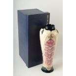 A Moorcroft pottery baluster vase, decorated with foxgloves, impressed and painted marks,