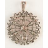 A large flowerhead pendant set with rose cut diamonds.