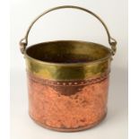 A Victorian copper and brass bucket, inscribed 'W.B.1864 M.B.', height 31cm, diameter 34.5cm.