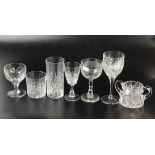 A collection of etched and cut table glass.