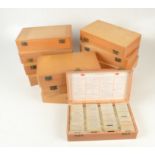 Twelve wooden boxes of coloured slides, covering European trips in the 1960s.