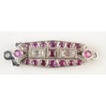 A George V baguette diamond and ruby clasp in 18ct white gold.