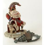 A painted cast iron doorstop depicting Punch, height 31cm, width 23cm, and a door knocker,