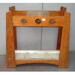 An Arts and Crafts oak hall stand, height 82cm, width 88cm.