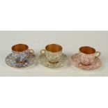 A harlequin set of three Royal Worcester porcelain cabinet cups and saucers,