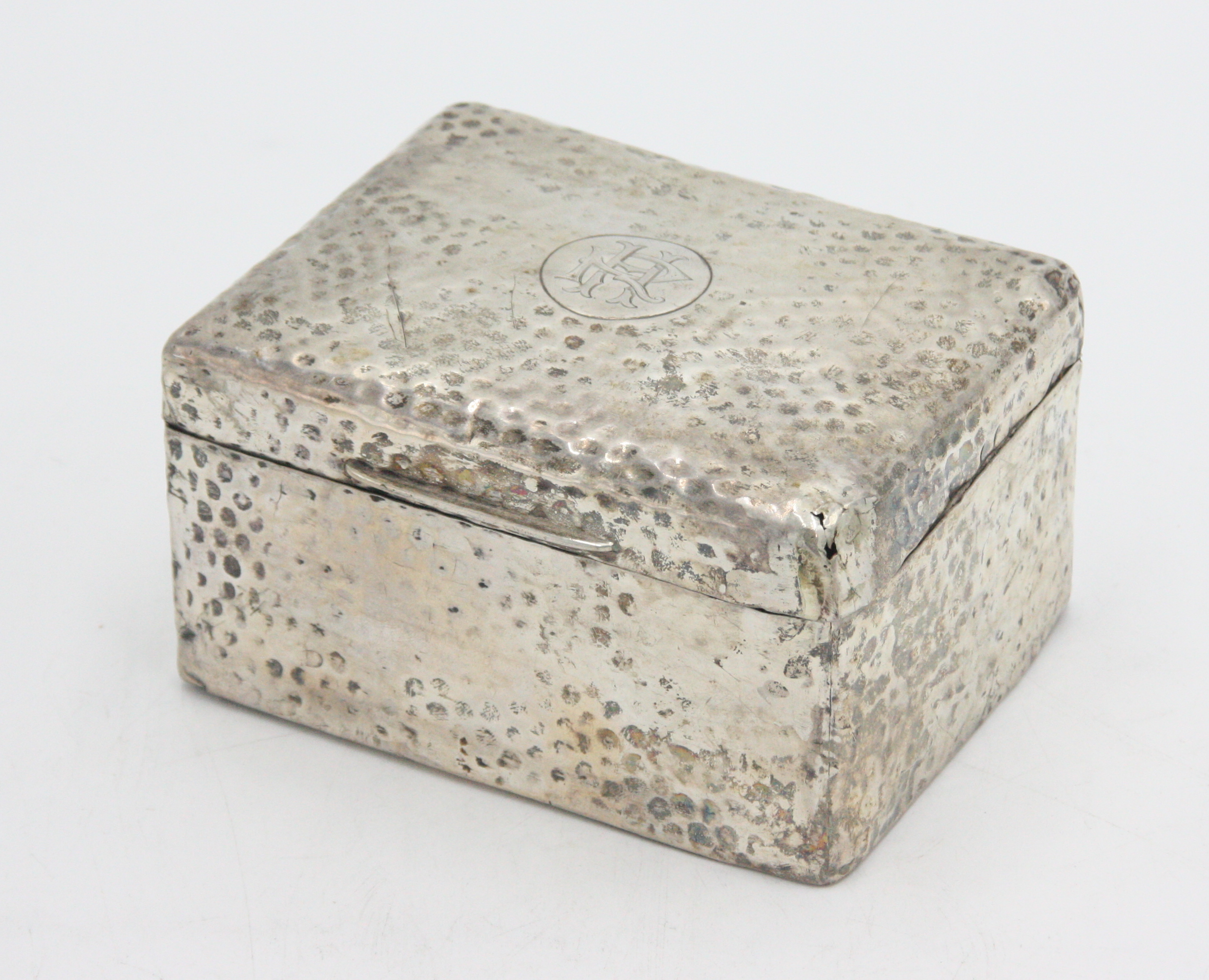 A silver cigarette box with wooden lining.