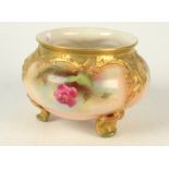 A Royal Worcester Edwardian blush ivory ground tripod bowl painted with roses, shape 183,