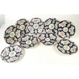 A set of ten 18th century Worcester scale blue ground botanical painted and gilt shaped plates,