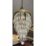 A gilt metal and glass chandelier, with leaf cast top,
