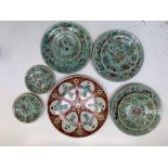 A Chinese famille verte charger, late 19th century, diameter 31cm and eight Chinese celadon plates.