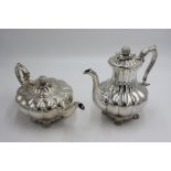 An early Victorian melon form fruit finial teapot and matching coffee pot.