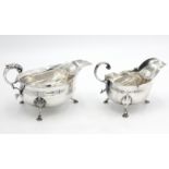 A heavy C J Vander Ltd silver sauce boat with scrolling acanthus handle on three acanthus capped