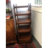 A Victorian mahogany whatnot, with five tiers and turned columns above a single drawer,