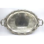 A large silver plated oval twin handled tray, 62.5 x 38cm.