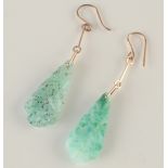 A pair of earrings in glass simulating jade.
